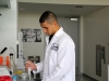Alex Chacon using a micropipette to transfer proteins.